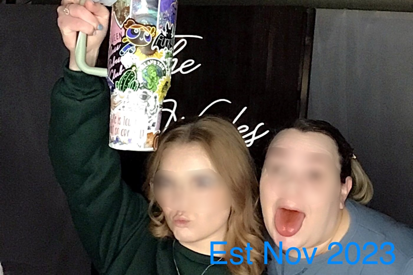 Friends posing at the photo booth